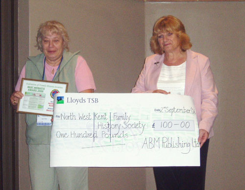 Joyce Hoad, Vice-President of NWKent FHS (left) receives the award and cheque from Sue Fearn, Editorial Manager of Family Tree Magazine